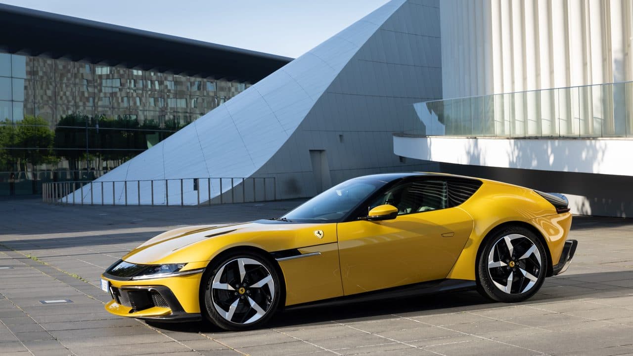 Ferrari 12Cilindri in yellow, side profile highlighting the long bonnet and fastback silhouette.