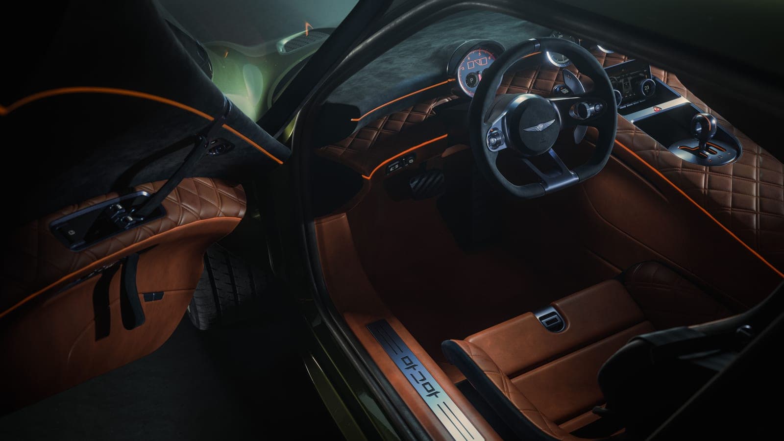 Inside the Magma GT — a twin-cockpit cabin in cognac leather, with an analog cluster and three centre-console dials drawn from motor-racing timekeeping.